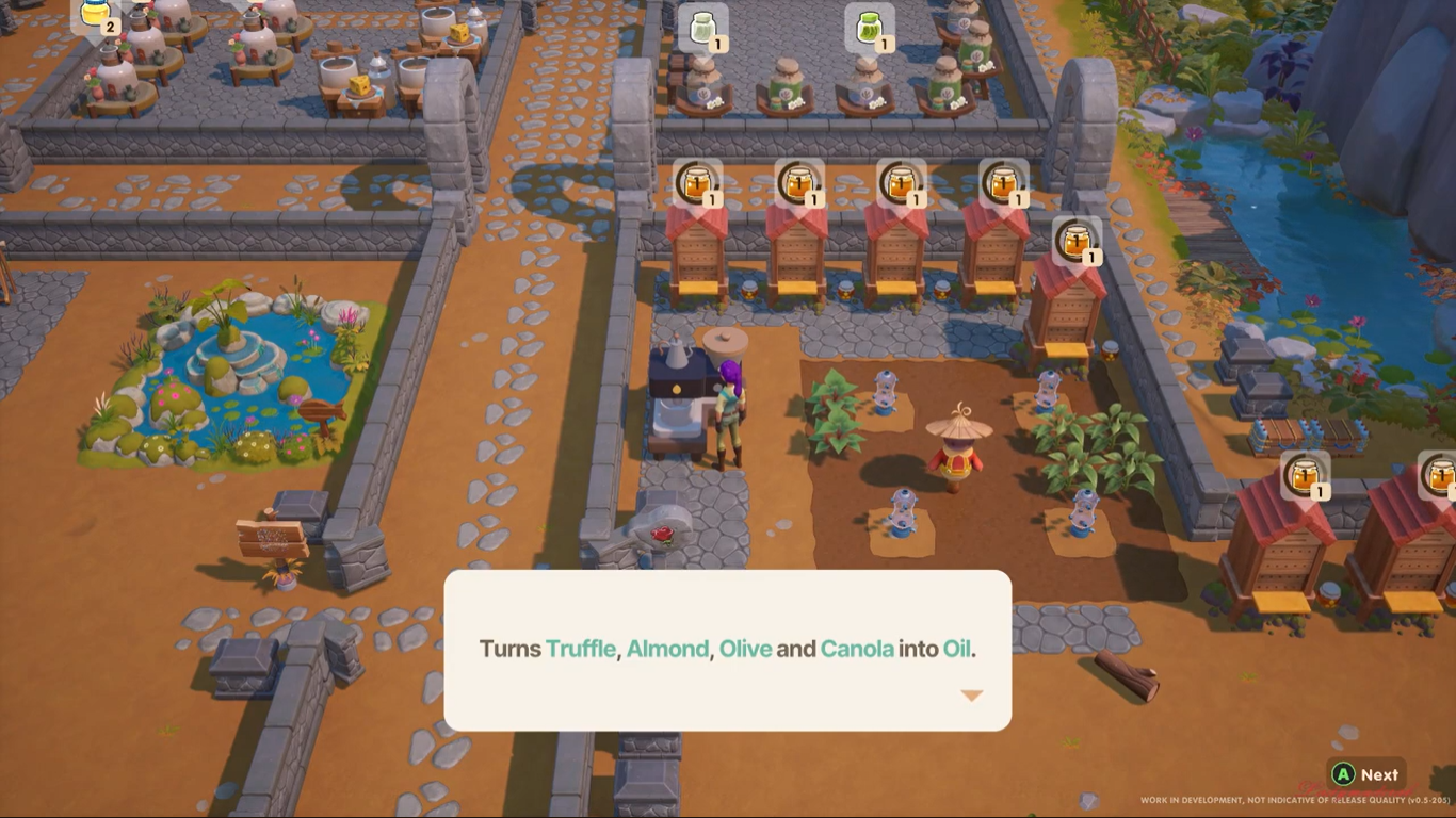 An image of the farmer standing near the oil press on her Starlet Town farm.